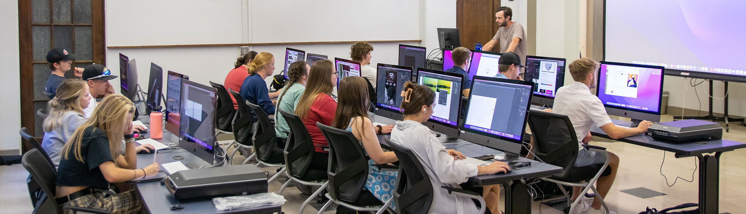 Classroom with three rows of desks.
