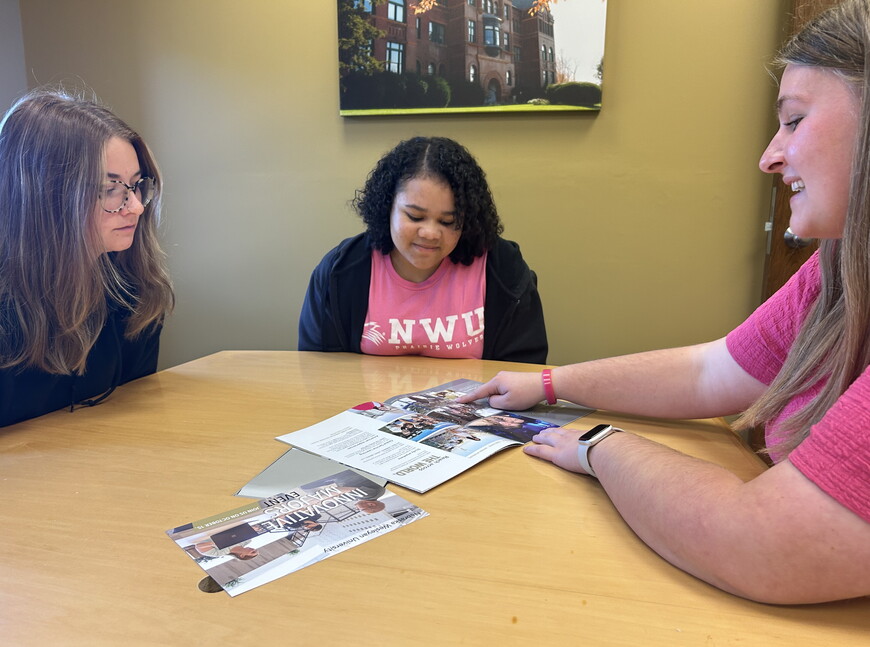 Students reviewing a book.