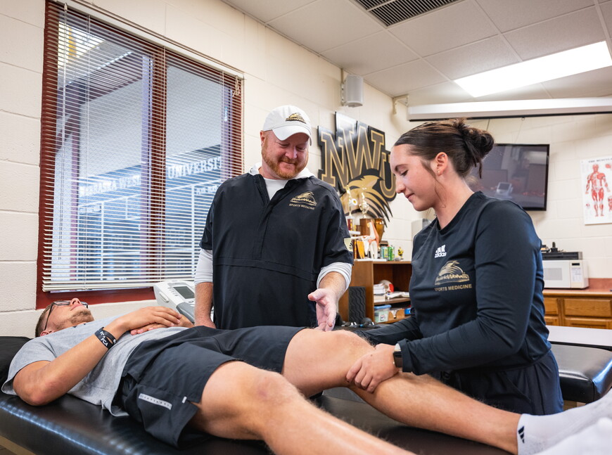 Jason Ensrud works with two NWU students.