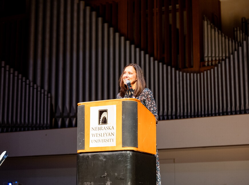 Carol Spahn, director of the US Peace Corps, gives remarks at podium.