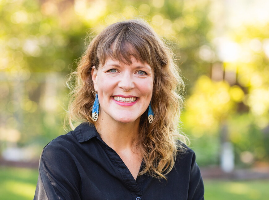 Kara Cavel poses for a professional headshot. 