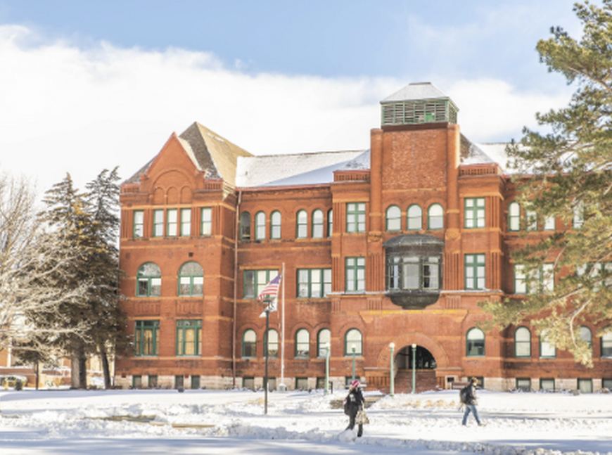 Snowy photo of Old Main.