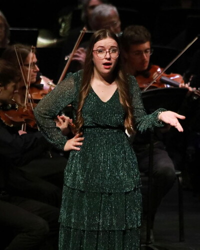 Shannon Engel performs a solo during a music production. 