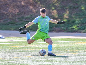 Zach Weis kicks a soccer ball during a NWU soccer game. 