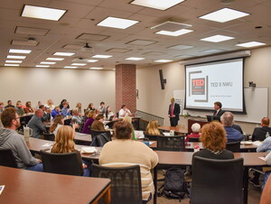 Chance Hergott and Zach Weiss present to a group of people. 