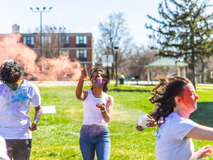 Students throwing color at each other for the HOLI Festival. 