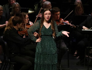 Shannon Engel performs a solo during a music production. 