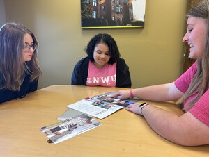 Students reviewing a book.