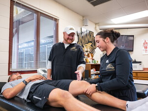 Jason Ensrud works with two NWU students.