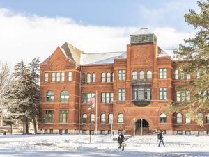 Snowy photo of Old Main.