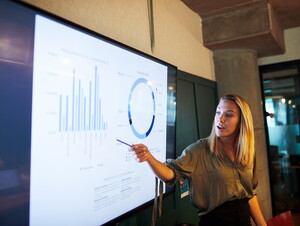 Student pointing to a screen.