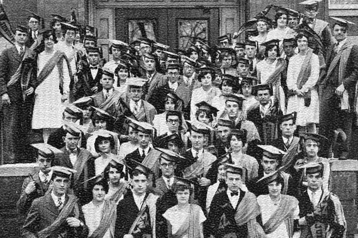 Large group of students in front of Old Main in the 1920s fashion.