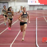 Bella Hogue runs on a track. 