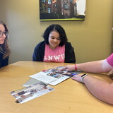 Students reviewing a book.