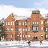 Snowy photo of Old Main.